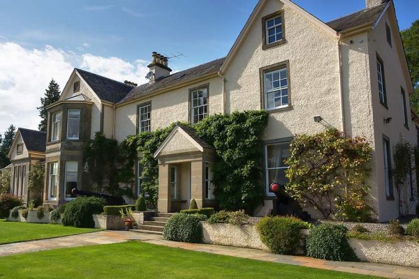 A colour photograph of the outside of Edradynate Country House External View - Luxury Scottish Country House for Rent & Sporting Estate in Perthshire, Scotland, available for rent, shoot days, fishing and family holidays on a catered or self catered basis.