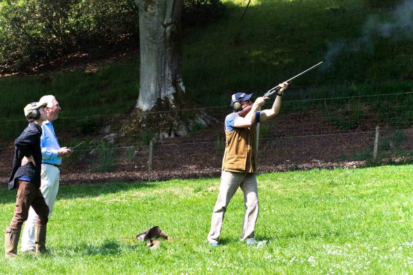 A colour image of Michael Campbell spectating clay pigeon shooting at the Edradynate shoot day in May 2017 -Edradynate Estate, Perthshire - Luxury Country House and Sporting Estate for Rent in Scotland